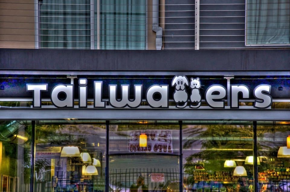 The Tailwaggers name and dog-and-cat logo above a store entrance.